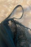 Left bra strap is sewn through the two layers on the bra area. The right side is perfectly fine - kind of stinks because I love everything else about this dress! - Emily D.