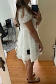 It looks horrible if you're petite/short. Would have to get it hemmed but seems difficult with the flowers. It's really pretty and great quality but I just looked like a balloon. - Alexia G.