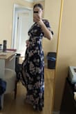 It was *just* the right length where it didn't touch the floor. I was worried about getting a dress that has no stretch but to my surprise, the middle and bust area fit perfectly. I love the uniqueness of the one arm style. - Meredith B.