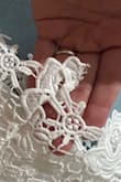 I ordered this dress for my bridal shower. The top was a little loose in the back and the button didn't hold very well. I had to have my fiancé pin the back of it together because If I leaned forward, the button would unhook and the dress fell forward. I resolved this dress but I thought it could have also been made better. The lacing on the seams doesn't match and those areas looked weird. I also had to cut a lot of loose strings off and also stitch some areas down because they looked out of place. - Jaclyn D.