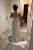 Loved the long train on this, but it's too va-va-voomey for my super simple wedding ceremony.  Too much cleavage  :) - Adrienne N.