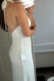I bought this dress for my wedding reception dress and was so excited but was completely let down for the quality. The top is lined more than the bottom half of the dress, which made the dress look like it was two different whites. The seam on the bottom half were like split? So they were very noticeable and overall poorly done. If the bottom half was lined as much as the top, i'm sure the dress would have been perfect. I even ordered the dress again to see if it was a one off but they were the same. The size was good and the length was great for my height, I tried it on with 3 1/2 inch heels and it was barely touching the ground. - Emily S.