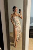 I'm typically a size small but I read the reviews before purchasing which lead me to buy a medium for this. This fit me perfectly but was even a bit snug in the bust area. I'm a 30ddd/32dd.  So size up if you have a bit bigger bust. I wore this for a photo shoot in Puerto Rico today with my family. It was perfect. I won't have the professional photos for a while but here's a couple I took. - Lauren R.