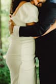 Very forgiving stretch with such a cute and unique toga/soiree/summer bride vibe. Shockingly worked well with no bra which is something I didn't imagine when I bought it. - El H.