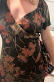 It looks just like the photo but it is slightly loose up around the sleeves and bust area. I'm usually a size 14 and ordered the XL. And it says midi but it nearly touches my ankles (I'm 5'6). I plan to get it tailored because I think it can be easily fixed. It's a really pretty fabric and I think it's perfect for a fall wedding. Note: in the photos, I'm pulling it back to fit better around my torso. - Christen K.