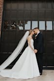 This dress was a dream! I had a disaster with my original wedding dress that I purchased from a bridal boutique and was scrambling to find a new one just two weeks before my wedding. I ordered this dress, and it arrived in four days and was perfect! In fact, I ended up falling in love with it more than my original dress! I received so many compliments at my wedding and people had no idea it was not a designer gown. I can't say enough good things about this dress, it was a lifesaver! - Leann T.