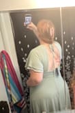 The material is typical for a bridesmaid dress. It arrived wrinkled so I had it dry cleaned. The back of this dress is so sexy! My husband loves it. I did have my aunt put a small stitch to bring in the cleavage a little because it was a little too revealing for me, but I plan to keep this dress to wear for date nights and such! - Katie R.