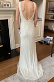 I love this dress! It is a very elegant option as a wedding dress, fit me great, and was comfortable. I would recommend wearing nude underwear as it is a tad see-through in bright light. I ended up going with a different wedding dress but really enjoyed the way I looked in this one. It shows all curves (or lack of in my case, which didn't bother me). The beading is beautiful. - Patricia R.