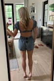 This denim romper fits great! I ordered a size small which is my usual size. The small of my waist measures 26.5", but I typically buy high-rise size 25 jeans. I have an athletic build and I'm 5'3". The fabric is thick but soft. I don't have a bra on in this photo, but could totally get by without one. - Emry B.