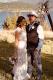 I loved this dress from day one. I ordered it and sat on it for a year while I tried 50 other dresses, but kept coming back to this one. My family didn't like it in the beginning so I kept trying to talk myself out of it. Well, I'm glad I didn't! It was PERFECT for our July country wedding. My hubby thought it was super sexy despite me being classy, as well. It's also super comfortable and breathable. I had cap sleeves put on as the sleeves had a bit too much poof for me. Also, I had the nude skirt lining lengthened a bit and pinned down so it wouldn't ride up. Worked with cowboy boots for the win! I even did a skirt change halfway through the night! Paired it with a champagne tulle skirt and a cowboy hat. - Heather K.