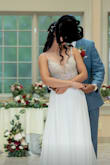 I wore this as my white dress for my wedding! I was in between a 2 and a 4. I had to order the 4 and have it taken in slightly and hemmed the front. The dress was very comfortable, light, and flowy. I was only in it for a few hours before I changed into my other dresses. - Lisa L.