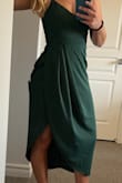 I love this dress! Has a great cut and fit except the bust has a weird seam that adds too much fabric making the cups look pointy no matter what and the dress came with a small pull in the front of the dress. - Amanda G.