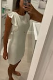 I don't know why I waited so long to order this dress, but I love it. I feel like lately I'm between a small and xs in lulus dresses, but this xs fits perfectly. It's maybe a tad short for work but I'm wearing it anyway. It falls about mid thigh. - Caroline M.