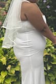 This I got this dress for a courthouse wedding ,however the courthouse didn't do actual marrying part so we had to do it in the park .I didn't want anything too over the top at the courthouse,but if I knew it would of been in the park I would of went a little more over the top,i I choose this one it fitted very comfortably however be mindful of the shapewear you decide to wear underneath because it shows everything,I put on new shapewear the day of and I regretted not doing a test run. It a safe dress if you need a just in case dress in your back pocket or if you need it for like a bridal shower. - Merayna D.