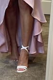 Fit true to size, however, it's weird on the pinky toes. The band covers my pinky toes so it looks as though I only have 4 toes but I do have wide feet. I'm a size 8 but need a 9 due to the width of my foot. So it's probably just my feet. I did not wear them out yet so I'm not sure how comfortable they are but they are super cute and were easy to walk in when I tried them on at my house. - Lisa F.