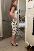 This dress fit like a glove and in person it is beautiful! It is very well made with a lot of detail and the ruffle shoulder gives it some edge. Love it! - Kelly N.