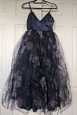 Agree with the other review. This dress is has way more poof than is pictured and creates a much larger silhouette compared to the model. The fabric was really pretty, but found it impossible to reduce the excess poof. Nice design in concept but did not deliver on execution. - Jess V.