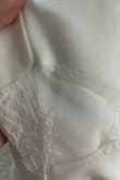 The item came with two holes in the lace cutouts on the side and a few pulls in the sleeves. - Sara K.