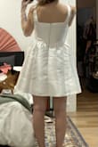 This dress makes me feel like a cupcake in all the right ways! It's cute, bridal, and I'm planning to wear it as a party dress during my wedding reception. I'm generally a size small in Lulus dresses, and a 4/6 in shirts/dresses, but the small was a bit tight. This is a corset though, and does the job it's supposed to do. Lots of support and coverage. My plan is to wear it a few times to stretch it out slightly so that it's a bit more comfortable. It was super difficult to zip over the waist where the skirt and corset meet, but my fiancé was eventually able to zip it up. - Melanie Y.