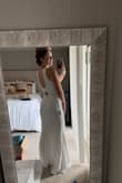 This dress is really flattering and SOOOOO comfortable. Unfortunately, it didn't make me feel bridal enough, but if I hadn't wanted it for my wedding, it would've been a perfect dress for any other event. I material was stretchy and made me feel so relaxed yet classy. - Lenae L.