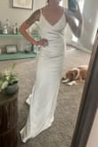 This dress fit like a glove. The material is a bit stretchy, shiny, and felt expensive. Loved the low back and the ability to lengthen or shorten the straps. - Shelby J.