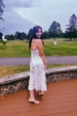 This dress is stunning. The fit is pretty great, but the back lays a bit differently than it appears on the model. I got so many compliments at my bridal shower! - Sarah R.