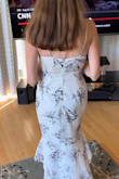 I bought a size small and it fits perfectly! It makes my figure look great and is 1/2" above the floor in the back when I wear 3" heels. I was looking for a dress to wear to a summer outdoor wedding in Charleston and this dress is ideal. It is comfortable, fits well at the top, and I am able to wear it with a strapless bra. The fabric looks high quality but is breathable. It does appear to be delicate so it would not be a good idea to buy a size that is too tight. It is now absolutely my favorite dress and my husband wants me to buy it again in a different color. - Robin B.