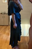 I'm very petite with a small chest. I ordered XS and it fit perfectly except for the waist, [which] was super tight with no stretch. No reason for it to be so tight since it has the tie to cinch the waist. It wouldn't be comfortable to wear at an event or if I ate a little. So I had to return and order a Small. Now it's a little loose up top, but it works. I love the sleeves. They are super cute. My favorite is the fabric because it's not just a solid color and gives it an elegant/upscale look. I will probably tack the chest area so it stays closed. I like that it comes with a liner so if the front opens, there's still coverage underneath - Haley K.