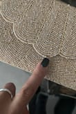 This clutch is stunning, and I love the strap. I purchased this for a wedding, and it unfortunately arrived with missing beading. I don't have the option of returning this because the event is tonight, and I don't have any other options. - Jackie B.