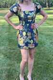 I originally bought this dress in pink as a small, but it was too short. They did not have the pink in medium, so I purchased this navy one in medium. The gold pops! The quality is great! It is extremely short so be prepared to show off your legs. Received many compliments! Such a fun dress! - Anna P.