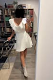 The quality of the dress is great, received many compliments. The ruffles at the top are easy to iron. The fit is true to size. - Andrea C.