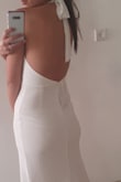 The dress itself is beautiful, but the fabric isn't that great, maybe in other colors it wouldn't be that noticeable. It runs a bit large, especially in the chest, would order a size down. - MAY S.