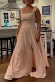This dress is so pretty and the quality of the material is lovely. The skirt drapes/flows very nicely. I was surprised by the bust being a little tight (not usually an issue for me!) but I wouldn't change the size for myself. Of course, I need to hem it but that's normal for my height. The lining is smooth and satiny - so nice. Very happy with the purchase! - Julie B.