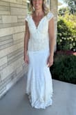 This dress would have been perfect if only it wasn't so yellowish/cream. The floral lace is beautiful and reminds me of sunflowers. I loved the cap sleeves and fit of this style but just couldn't get over the color not being a true ivory/white. We even tried placing a white t-shirt underneath the skirt (2nd photo) to see how it'd look if we replaced cream liner with more of a true white/ivory liner, but still made the top lace look too yellowish. Returned this and chose another dress for my wedding, BUT I found Lulus has a shorter version of this same exact lace dress (search Back In Time White Lace Sleeveless Bodycon Mini Dress) that IS perfect WHITE color (with white liner!) and I immediately bought that to wear as my elope dinner/reception dress&WIN-WIN! :) - Samantha P.