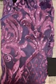 Again enhanced color online.  This is a very plum color and the sequins are almost pink.  If you like the color I'm posting then order.  It fits really nice to your body.  A small was very snug on me. - Deborah V.