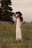 While it won't make you as slender as the model, it is a beautiful dress that flirts between formal and casual depending on how you dress it. Used it for family photos and it seemed to photograph well. Now I kind of want to dye it another color to wear to a friend's wedding. - Meredith C.