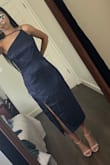 The overall dress is nice. Fabric is a bit thinner than I expected but still good quality. I did not have an issue with wearing the straps like the model, but the dress was huge on me. I usually wear small, but I should've gone for the extra small on this one. I had to return. - Rocio A.