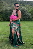 I wore this dress to an outdoor summer wedding! I fit best with a medium for this style. I am usually a large. I am 5'2, 168 lbs and my chest is a DD. I did get this dress altered because it was a bit long. I am only 5'2. The straps held my breasts up all night. LoL. I used tape to hold the insides, but the dress fit beautifully and the quality is really nice. I made sure to put it in the cleaners and it is a great addition to my closet. - Angelique R.