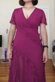 Very cute dress, fits nicely. I would say it's true to size. I usually wear 10-12 or Large, and the Large fits me perfectly. I'm 5'5", and it comes down to around the calves. It shows some cleavage so keep that in mind. I'm gonna use a safety pin to make it less revealing on the top. The fabric is nice and light. - Aidana A.