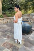 I wore this dress for my rehearsal dinner, and it was absolutely stunning! It fits well, the bow is amazing, and I couldn't have imagined a more perfect dress! - Nadine J.