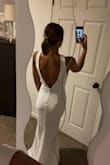 I tried this on as my potential wedding reception dress. I loved it, however, the straps were a little too big for me, which made the back gap a little on the sides. But I loved the buttons going down the back! - Alexa T.
