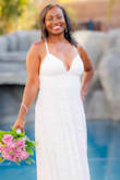 I purchased this dress for my 20th vow renewal. The dress looked great. I loved the back and the slit. Perfect for the summer. It was a little long. I would, normally, have gotten it hemmed but didn't have the time. Normally, I wear a small but had to size up to a medium for my waist. This was the case for most of the dresses I tried on from Lulus. Fast shipping. - Monica T.