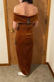 The first thing I noticed with the material, it's a really nice, thick velvet with a slip underneath. I was really happy with the quality for the price. The rust is a kind of golden brown. I was worried it would be too orange, but it's a really lovely autumn color. I, personally, am not going to keep this dress as it doesn't stay up on me. The front has a non-slip rubber to stay up, but as I am pear-shaped my chest is smaller and I don't really fill the top out. If I stand with good posture it stays, but as soon as I slouch it falls down to my ribs. I don't think down-sizing to an XS would help as the S fit everywhere else on me. So, if off-the-shoulder dresses flatter your form and you have a larger chest or upper body than me this should fit wonderfully. Overall, this doesn't work for me but I can see this working on other people and it's of wonderful quality. - Davyn L.