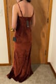 The material is a nice, thick, lush velvet. The brown is a really beautiful auburn color and overall it's super nice. It's quite a long dress, so wearing my 6" platform heels they were a good inch or so above the ground, but if you're shorter or have shorter heels there's the risk you might need to hem it. The cowl is a false cowl. Personally, I liked this as I don't have to worry about leaning over and anything showing, but it's something to keep in mind if that would bother you. My biggest problem is the waistline. It fit a little boxy on me as the narrowest section is at the top of the ribs. It was still a really flattering dress, it just didn't hug me as much as I wanted. I think an XS would be too small on me though. Also good to keep in mind that the slit is decently high and forward. - Davyn L.