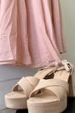 I ordered an XS because S is sold out. It actually fits well, with a little room. There is a lot of extra fabric on the dress if alterations are needed, but I think I'll leave mine as is. I am a little disappointed in the color of the dress. I expected it to be a muted blush, closer to beige, it is definitely more pink than beige. I ordered a pair of nude shoes to match. In the online photo, they look very similar in color, that is not the case irl. Also, I think this dress is too heavy for the straps, and the straps are not the right material to support the dress. Just trying the dress on and walking around for five minutes, I started to feel like the straps were digging into me and possibly giving me a "rug burn." I will add some type of buffer/support before wearing this out. - Anna R.
