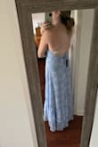 I am usually between a medium and a large at Lulus but the medium was perfect for me with the adjustable back and straps. The material is very lightweight and the dress is so comfortable and flowy without too much excess fabric. I will be purchasing some fabric tape to help with the bunching around the chest area but otherwise, it is the perfect dress! - Madeline Q.
