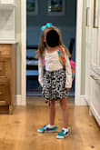 The fabric is light and flows well. Colors are great. I love how it wraps and ties at the front. Unfortunately, it was so short I ended up modifying the waist and giving this to my 6 year old. - Christine H.