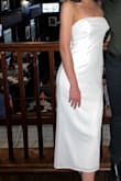 As a bride, it's very hard to find a white dress for all the different bridal events. I settled for this one for my welcome cocktails. I got an XS and couldn't size down anymore. It was a little big and the removable bow really weighed it down. I was constantly pulling up the dress throughout the night. The front didn't give much shape either. - Sarah D.