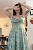 I love this fabric and color. I think it's so pretty and feminine. And the slit is a great height on me. I had to get a little length taken off at the tailor, but I wasn't drowning in it when I wore heels. The only problems I really have with the dress are some loose stitches by the zipper and a little bit of an awkward neckline. Wearing a strapless bra smoothed out the strange shape, though! - Hayley L.