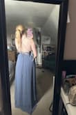 The color is stunning and just as pictured. The dress itself has a little bit of weight to it, but when it's on you can't tell. The quality of the material is incredible and I cannot wait to wear it in a few weeks! - Leya M.